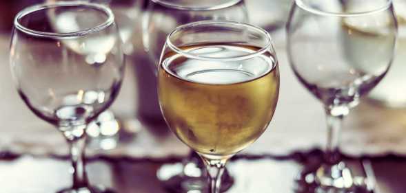 Several drunk glasses of wine and car keys next to them.