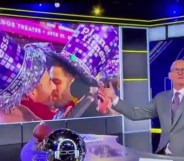 Scott Van Pelt goes viral for his reaction to a gay kiss. Image of the host in his studio with the gay New Year's Eve kiss on the screen behind him