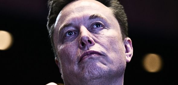 A shot of Elon Musk looking upward.