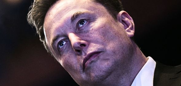 A tilted photo of Elon Musk.