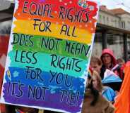 Participants wave a huge rainbow flag in the 17th Christopher Street Day (CSD) parade in Cottbus, Germany, under the motto United in Peace and Diversity