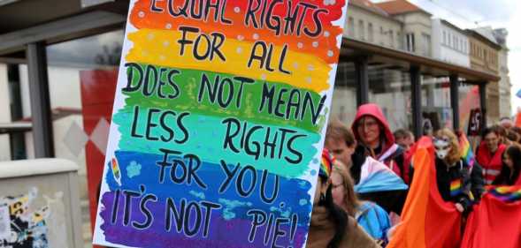 Participants wave a huge rainbow flag in the 17th Christopher Street Day (CSD) parade in Cottbus, Germany, under the motto United in Peace and Diversity