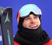 Gus Kenworthy of Team Great Britain reacts after their second run during the Men's Freestyle Skiing Freeski