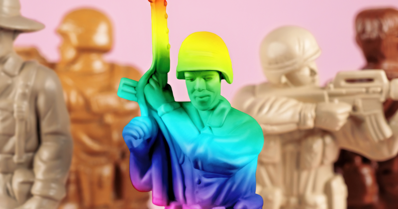 A rainbow toy army man next to a set of beige army men.