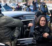 ICE agents detain a woman after pulling her from a car on 13 January, 2026 in Minneapolis, Minnesota.
