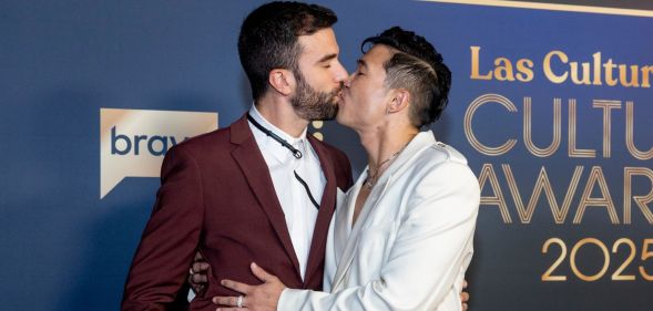 ohn-Michael Sudsina and Joel Kim Booster arrive at the Las Culturistas Culture Awards at The Orpheum Theatre on July 17, 2025 in Los Angeles, California.