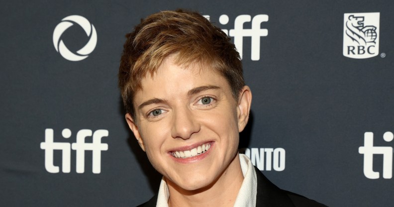 Comedian Mae Martin smiling at the camera