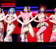 Music group XG performing.