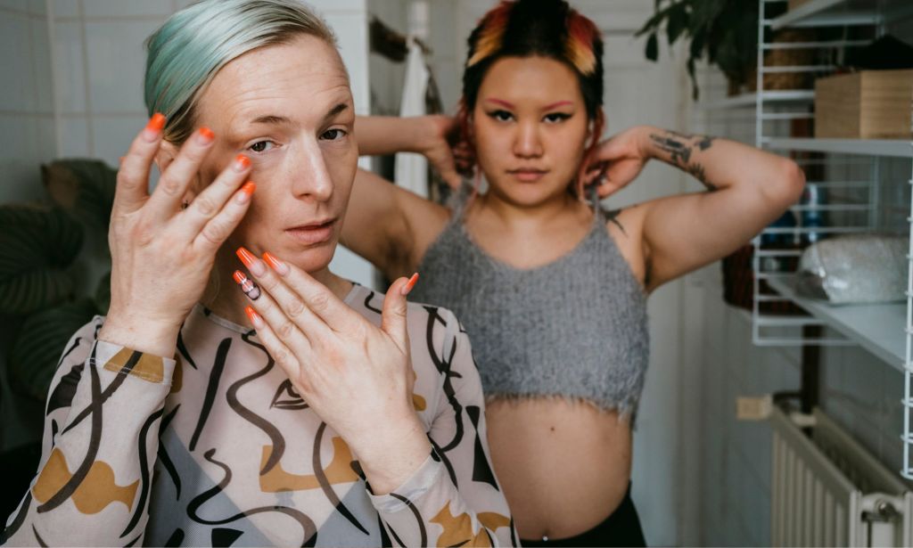 Two people getting ready in their bathroom.
