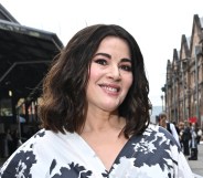Nigella Lawson wearing a white and black floral dress, smiling at the camera