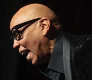 Rupaul laughs while speaking to a large audience to discuss his memoir 'The House of Hidden Meaning'.