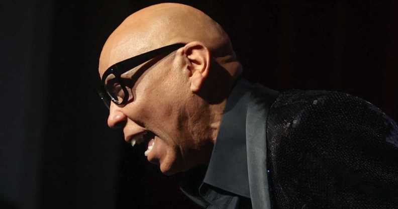 Rupaul laughs while speaking to a large audience to discuss his memoir 'The House of Hidden Meaning'.
