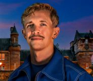 Stephen in front of The Traitors castle in a blue jacket