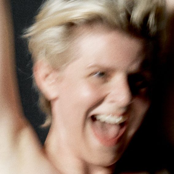 Robyn’s Sexistential album cover, blurry image of her with her arms in the air