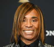 Billy Porter pictured smiling with a bob hairstyle.