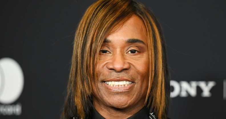 Billy Porter pictured smiling with a bob hairstyle.