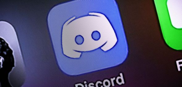 A phone with the Discord app displayed.