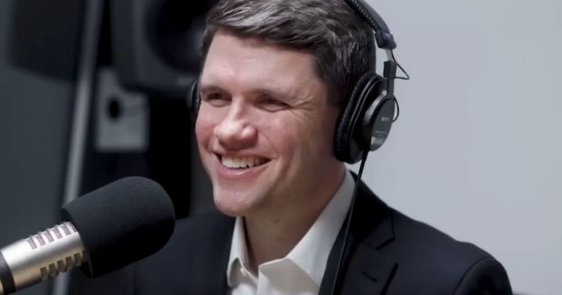 James Talarico, pictured in a recording booth with headphones on.
