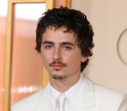 Timothée Chalamet headshot, wearing a full white suit