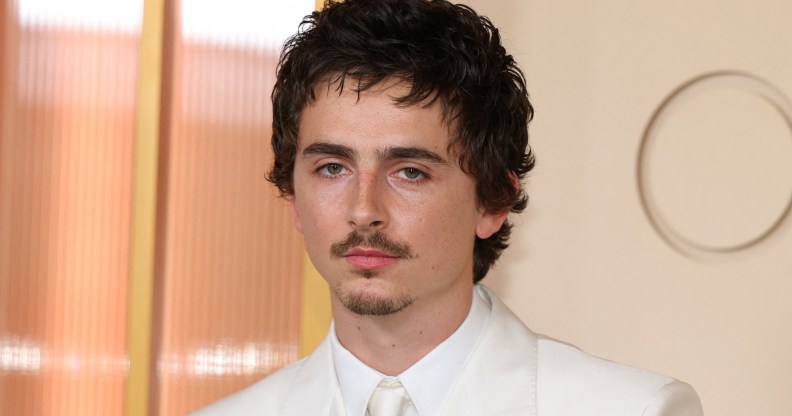 Timothée Chalamet headshot, wearing a full white suit