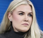 A portrait image of Erika Kirk looking off to the right.