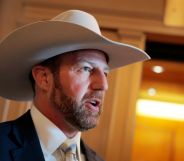 Markwayne Mullin, a white man with a beard, wearing a cowboy hat