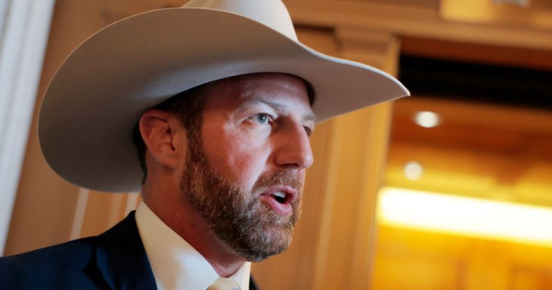 Markwayne Mullin, a white man with a beard, wearing a cowboy hat