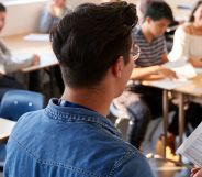 The back of a teacher at a school.