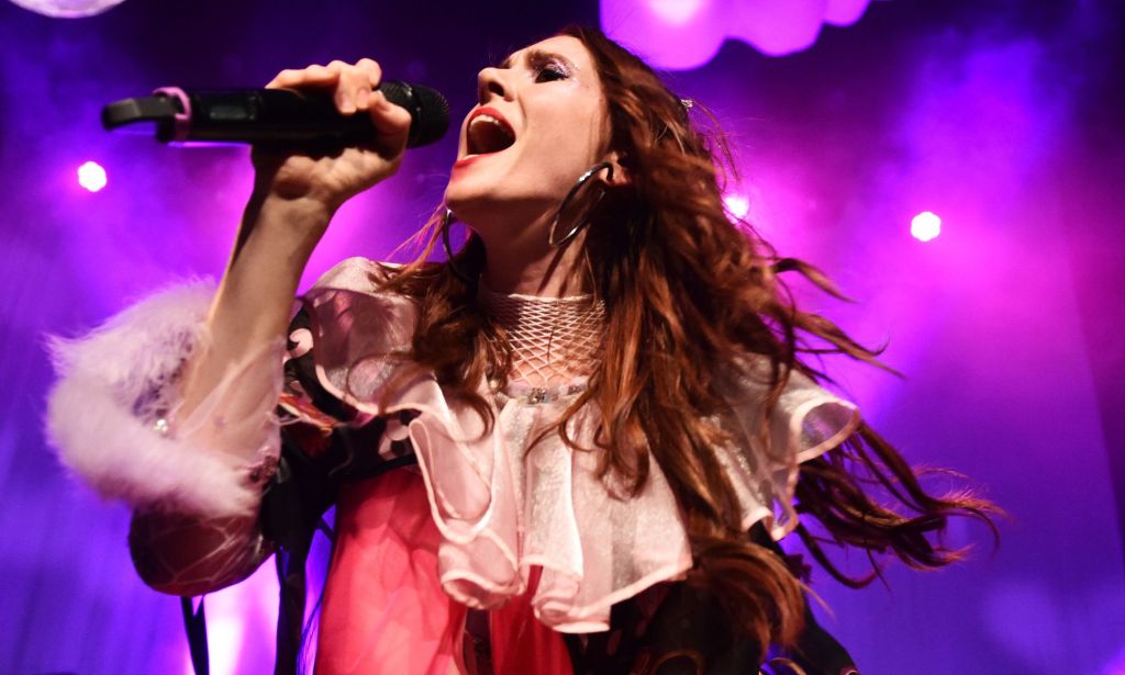 Kate Nash, pictured singing into a microphone.