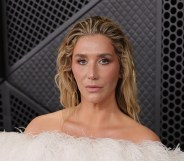 Kesha attends the 68th GRAMMY Awards, wearing a strapless feathered white dress.
