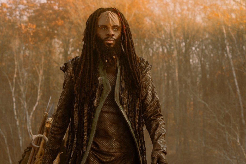 Actor Karim Diané as Jay-Den Kraag in Star Trek: Starfleet Academy. He has long dark brown dreadlocks and a camo mesh coat