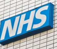A skewed shot of an NHS sign.