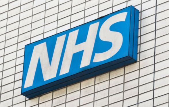 A skewed shot of an NHS sign.