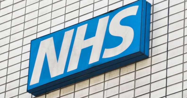 A skewed shot of an NHS sign.