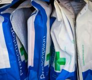 A row of prescription bags in a pharmacy.