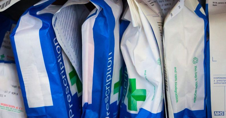 A row of prescription bags in a pharmacy.