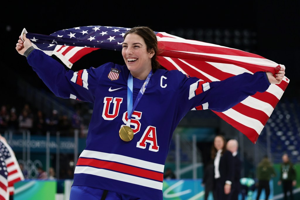 Gold medalist Hilary Knight #21 of Team United States celebrates after the medal ceremony for Women's Ice Hockey