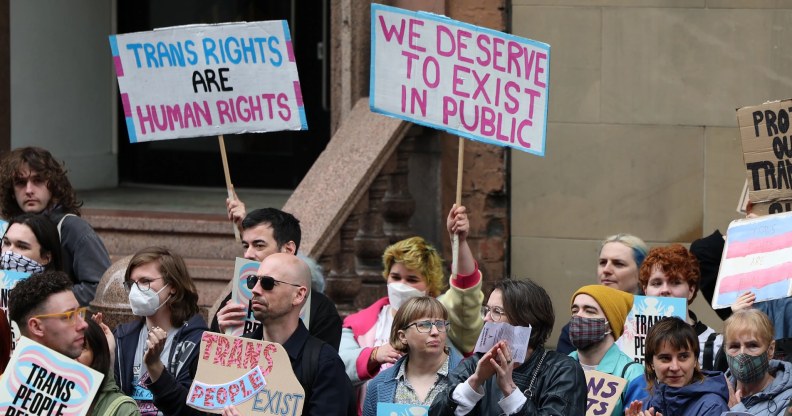 Trans rights demonstrators gather outside the Equalities and Human Rights Commission