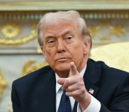 Donald Trump pointing towards the camera.