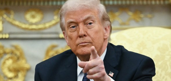 Donald Trump pointing towards the camera.