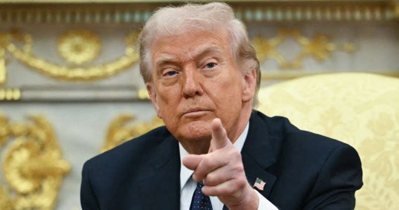 Donald Trump pointing towards the camera.