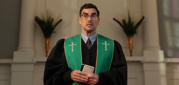 Big Mistakes Dan Levy as pastor Nicky, preaching in a churce