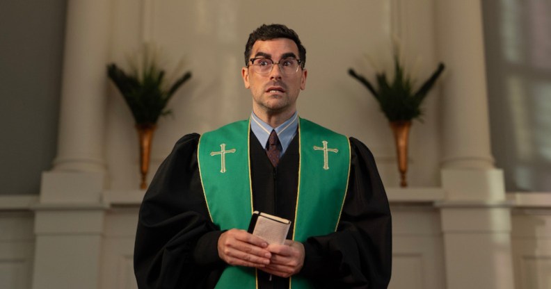 Big Mistakes Dan Levy as pastor Nicky, preaching in a churce