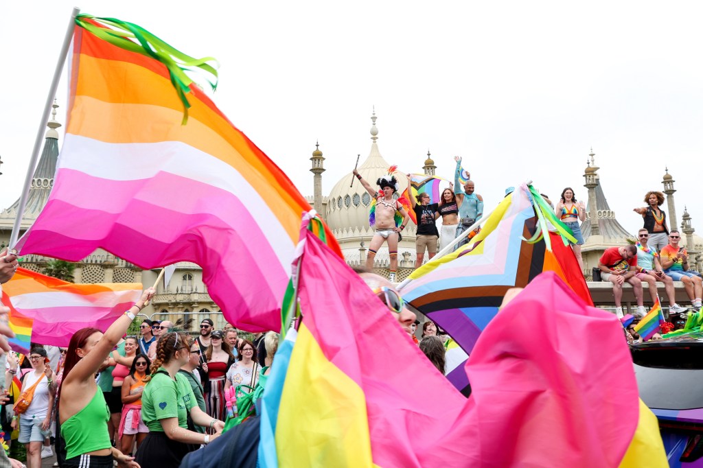 Pride in Brighton, lesbian flags and people celebrating