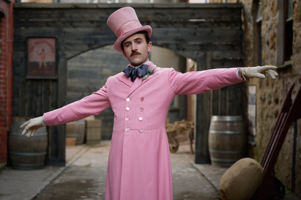 MadFabulous still: a man in an all-pink long coat and top hat