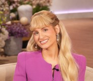 Meghan Trainor in a pink top smiling