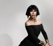 Drag Race: Philippines star Misua in a black dress and chunky gold jewellery