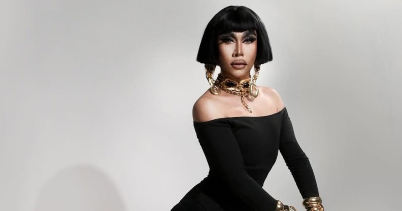 Drag Race: Philippines star Misua in a black dress and chunky gold jewellery