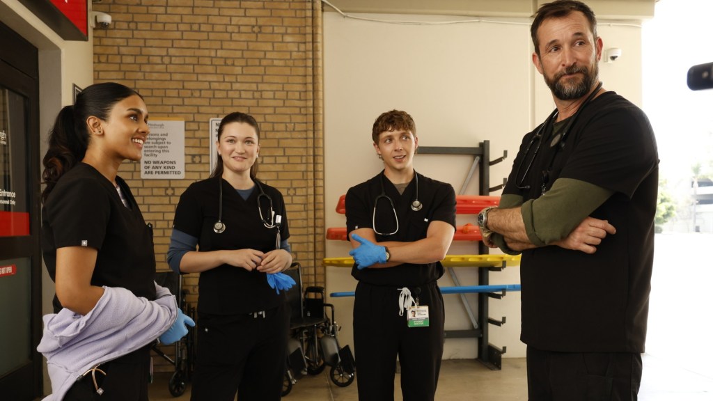 still from The Pitt, four medical staff in an entryway