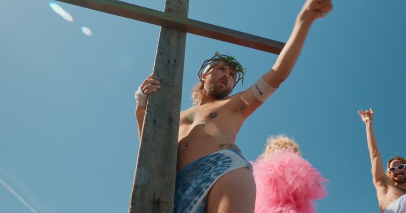 The Sisters of Perpetual Indulgens host the Hunky Jesus competition. A nab ib stage dresses as jesus with a big wooden cross